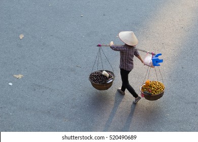 Hanoi, Vietnam, Nov 16, 2016: Street vendors in Phoco Hanoi (Hanoi's Old Quarter) It is one of some specific cultural features of Hanoi. They sell everything from flowers to foods to anything