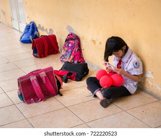 Hanoi, Vietnam - September 24, 2015: The Girl Is Reading A Story At The School