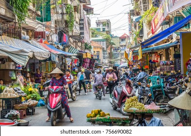 Hanoi,Vietnam - October 31,2017 : Busy local daily life of the morning street market in Hanoi, Vietnam. A busy crowd of sellers and buyers in the market.
