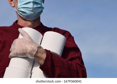 Hants, UK. March 22 2020.  A Male Community Volunteer Carrying Toilet Rolls As He Delivers Essential Supplies To Vulnerable And Elderly People Self Isolating During The Coronavirus Covid-19 Pandemic