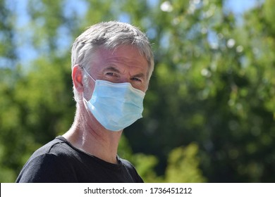 Hants UK. May 20 2020. A Man Wears A Face Mask To Help Prevent Infection By Coronavirus Covid-19 As The UK Eases Lockdown Restrictions Wearing Face Coverings Is Advised For Shops And Public Transport.