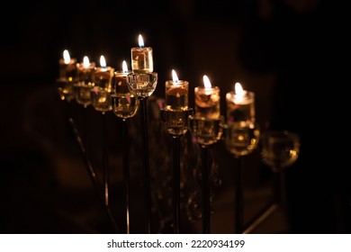 Hanukkah menorah with oil lights burning in Jerusalem during the celebration of the Festival of Lights in Israel.