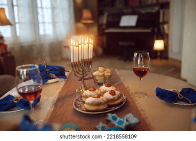 Hanukkah Table Setting With Lit Candles In Menorah At Home.