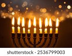 Hanukkiah, Hanukkah Menorah with burning candles on dark background with golden bokeh lights. Celebration Hanukkah concept.