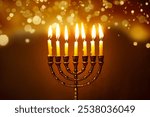 Hanukkiah, Hanukkah Menorah with burning candles on dark background with golden bokeh lights, copy space. Celebration Hanukkah festival concept design.