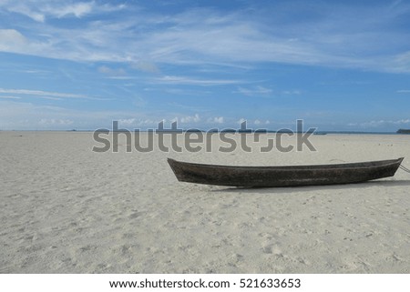 It happens at Ohoidertawun Beach in Kei Island, Southeast Maluku, Indonesia. It is when the sea is receding up to 2km so you can go to another island on foot. The boat here is missing the sea.