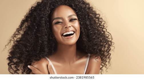 Happily laughing Beauty portrait of african american woman with afro wavy hairstyle . Smiling dreamy beautiful  girl. Curly black hair Cosmetology , beauty  and spa - Powered by Shutterstock