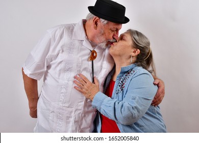 Happily Married Couple Kissing
  Man And Wife In A Kissing Embrace
  Grandpa And Grandma Happy To Be Self Isolating.  A Blessing In Disguise 