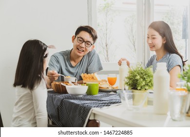 Happiness Asian Family Dad Mom And Daughter Enjoy Breakfast Together On Dining Table Wonderful Moment Family Concept