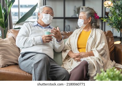 Happiness Asian Senior Couple Sit Relax Morning Conversation On Sofa In Living Room,old Asian People Wearing Mask Siting On Sofa At Home Home Isolation Ideas Concept
