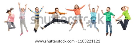 happiness, childhood, freedom, movement and people concept - happy kids jumping in air over white background