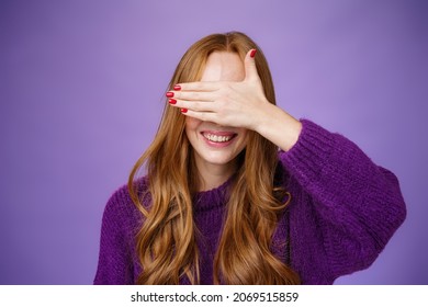 Happiness, Emotions And Anticipation Concept. Charming Dreamy Ginger Girlfriend With Cute Nails Covering Eyes With Raised Palm And Smiling Broadly Waiting For Surprise Or Miracle, Playing Peekaboo