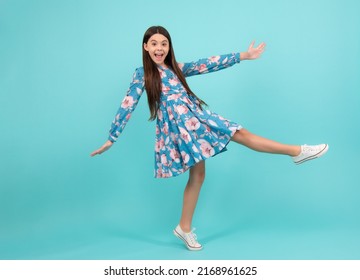 Happiness, freedom, motion and child. Young teenager girl jumping over blue background, funny jump. Excited teenager, amazed and cheerful emotions. - Shutterstock ID 2168961625