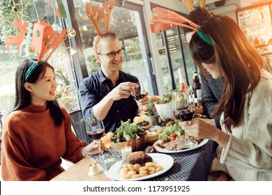 happiness friends thanksgiving christmas eve celebrate dinner party with food wine and laugh together with joyful moment - Shutterstock ID 1173951925