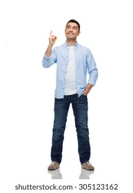 Happiness, Gesture And People Concept - Smiling Man Pointing Finger Up