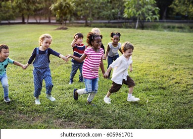 Happiness group of cute and adorable children playing in the park