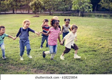 Happiness group of cute and adorable children playing in the park