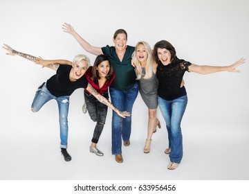 Happiness Group Of Women Arms Stretched And Huddle Playful