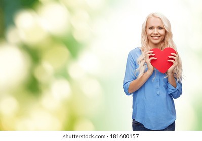 Happiness, Health And Love Concept - Smiling Woman With Red Heart