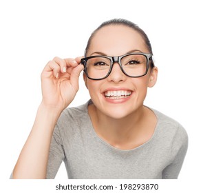 happiness, health and vision concept - smiling asian woman adjusting eyeglasses
