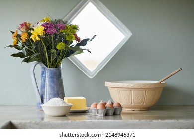 Happiness Is Homemade. Shot Of A Counter With Baking Ingredients Arranged On It In A Country Kitchen.