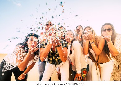 Happiness And Joyful Concept - Group Of Happy Women People Celebrate. All Together Blowing Confetti And Having Fun - New Year Eve And Party Event For Group Of Beautiful Girls -white Clear  Background