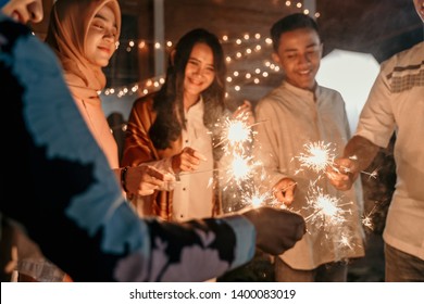 Happiness Lighting The Takbir Night Fireworks With Friends While Celebrating The Eid Holiday