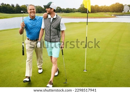 Happiness is a long walk with a putter. two friends out playing golf together in their free time.