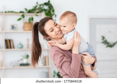 Happiness Of Motherhood. Joyful Millennial Mom Holding Cute Toddler Baby On Her Hands, Enjoying Spending Time On Maternity Leave