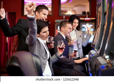 Happiness People Winning In The Casino On Slot Machines