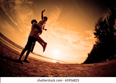 happiness and  romantic Scene of love couples partners on the Beach