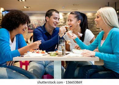 Happiness Teenagers Enjoying In Lunch At Restaurant