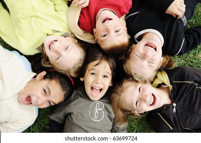 Happiness Without Limit, Happy Group Of Children In Circle, Together Outdoor, Faces, Smiling And Careless