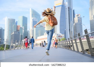 A Happiness Young Woman Enjoys Vacation In Singapore In Beautiful Day. Travel And Vacation Concept In Southeast Asia