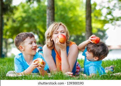 Happly Healthy Family, Mom And Kids With Apple