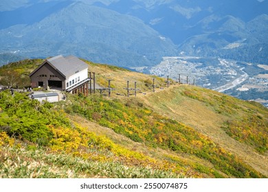 Happo Alpen Line Nature trail, Hakuba, Nahano, Japan, Scenic mountain view with rustic cabin - Powered by Shutterstock