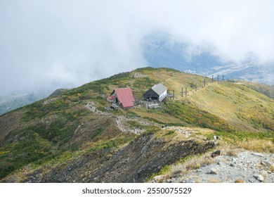 Happo Alpen Line Nature trail, Hakuba, Nahano, Japan, Serene mountain landscape with rustic cabins - Powered by Shutterstock