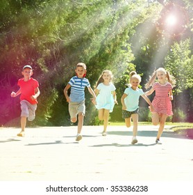 Happy Active Children Running In Park