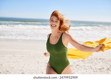 Happy active and curvy woman enjoying summer vacation while running at sea. Smiling curvy woman holding yellow scarf while walking at beach with copy space. Laughing girl in swimsuit looking at camera - Powered by Shutterstock