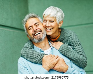 Happy active senior couple having fun outdoors - Shutterstock ID 2173990775