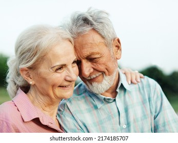 Happy active senior couple having fun outdoors. Portrait of an elderly couple together - Powered by Shutterstock