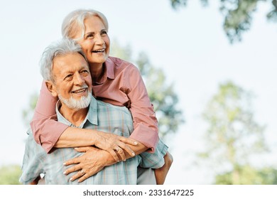 Happy active senior couple having fun outdoors. Portrait of an elderly couple together - Shutterstock ID 2331647225