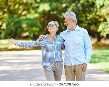 Happy active senior couple having fun talking holding hands and bonding in park outdoors - Powered by Shutterstock