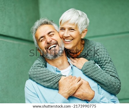 Happy active senior couple having fun outdoors