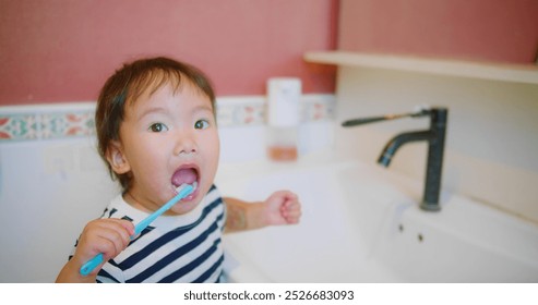 Happy Adorable little Child Brushing Teeth Smiling in Bathroom Morning Routine at Home Interior, showcasing a morning hygiene routine and healthy habits, Personal Care, Family Life, Childhood Moments - Powered by Shutterstock