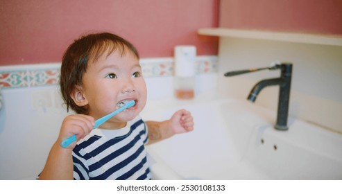 Happy Adorable little Child Brushing Teeth Smiling in Bathroom Morning Routine at Home Interior, showcasing a morning hygiene routine and healthy habits, Personal Care, Family Life, Childhood Moments - Powered by Shutterstock