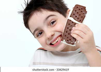 Happy Adorable Six Year Old Boy Eating Icecream Ice Cream Sandwich.