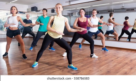 Happy Adults Having Group Fitness Class In The Sport Club 