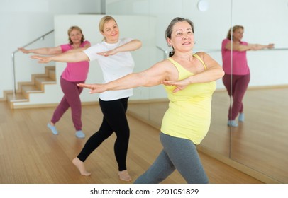 Happy Adults Training Swing Steps At Dance Class