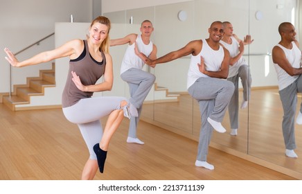 Happy Adults Training Swing Steps At Dance Class